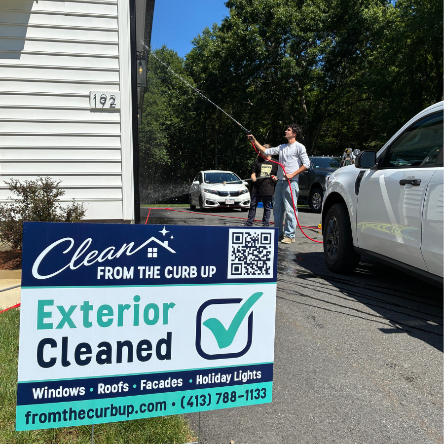 Clean From The Curb Up team cleaning a home exterior